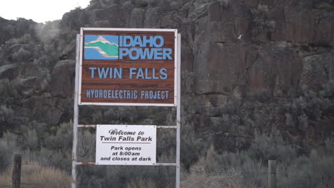 Idaho-Power,-Twin-Falls-Hydroelectric-Project-Road-Sign,-View-From-Moving-Vehicle