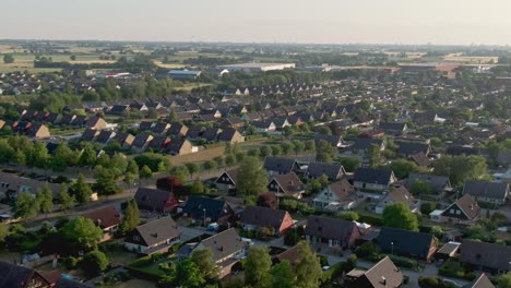 Bird's-eye-view-of-housing-area-in-Staffanstorp,-Sweden-with-scenic-landscape-in-the-background