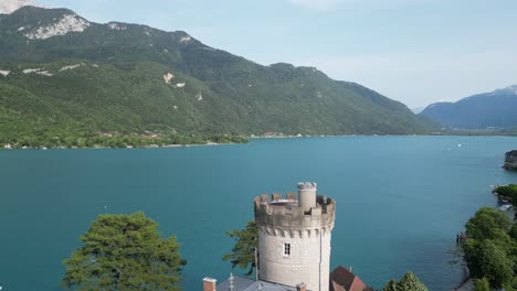Aerial-reveal-Chateau-de-Duingt-on-lake-Annecy-France
