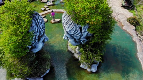 Top-Down-view-of-Giant-heads-Clay-Sculptures-in-Clay-Tunnel-In-Da-Lat-City,-Lam-Dong-Province,-Vietnam