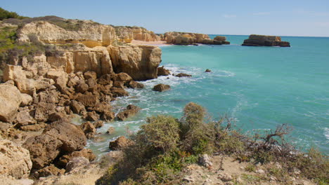 View-Of-Rocky-Coastline-In-Algarve,-Portugal---drone-shot