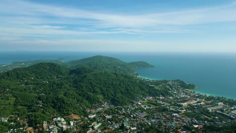 4K-Cinematic-nature-aerial-footage-of-a-drone-flying-over-the-beautiful-mountains-of-Phuket,-Thailand-on-a-sunny-day
