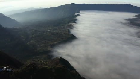 Aerial-view-of-a-fog-covered-valley-in-the-Bromo-Tengger-Semeru-National-Park-of-Java,-Indonesia