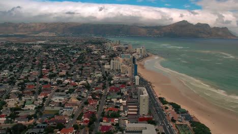 Aerial-view-of-Cape-Town-from-Table-Mountain,-South-Africa,-established-Aerial-shot-of-Cape-Town-city-and-beach-view,-Cityscape-and-dramatically-weather,-Shoreline-of-Camps-Bay