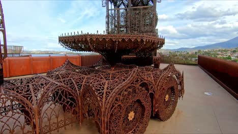 Hobart,-Tasmania,-Australia---17-March-2019:-Walking-along-beside-a-rusty-metal-artwork-at-Mona-Museum-in-Hobart-Tasmania