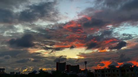 Timelapse-of-Heavy-dark-storm-raining-clouds-over-the-sky,-Beautiful-sunset-sky-above-clouds-with-dramatic-light