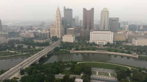 Aerial-view-of-Columbus-Ohio-city-skyline-on-a-foggy-smoky-day---approaching-city
