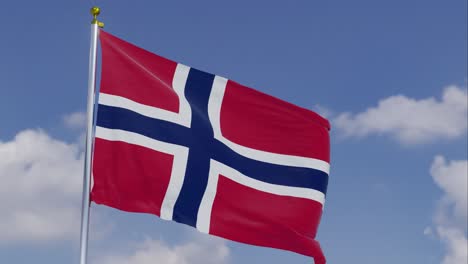 Flag-Of-Norway-Moving-In-The-Wind-With-A-Clear-Blue-Sky-In-The-Background,-Clouds-Slowly-Moving,-Flagpole,-Slow-Motion