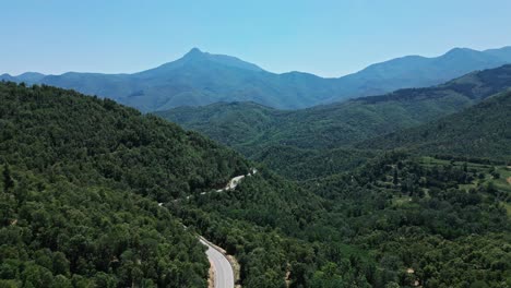 A-beautiful-aerial-view-of-a-mountain-road-near-Arbúcies,-Girona,-Spain
