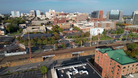 Wilmington-Delaware-drone-push-up-river-to-skyline-on-sunny-afternoon