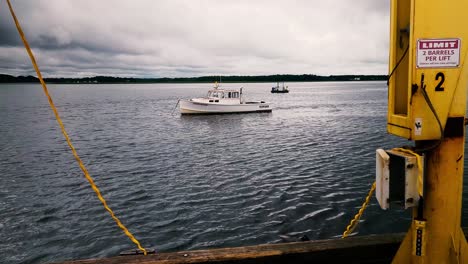 End-of-pier-showing-single-lobster-boat-in-calm-waters