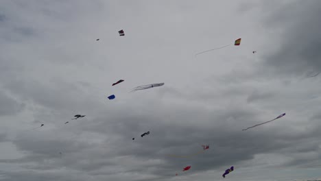 Multiple-colourful-kites-flying-high-in-the-sky-captured-in-slow-motion