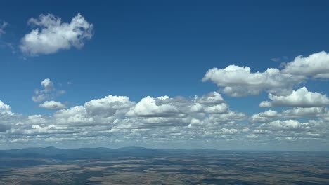 An-unique-pilot’s-perpective:-flying-across-a-typical-sumer-sky-with-some-tiny-cumulus-clouds-ahead