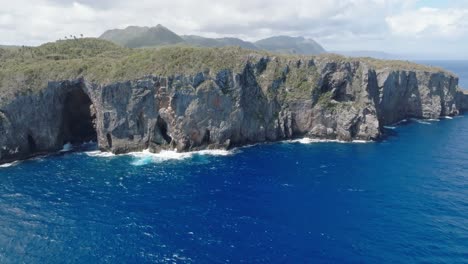 Aerial-wide-shot-of-Nationalpark-Cabo-Cabrón-with-rocky-coastline-and-blue-Caribbean-Sea-during-cloudy-day