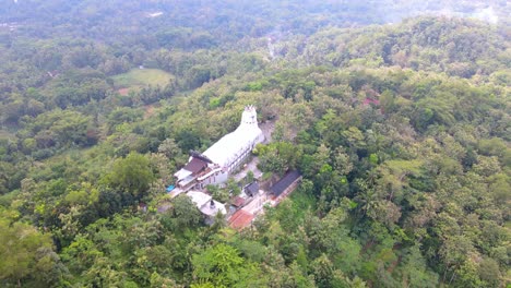 Aerial-view-of-unique-chicken-shaped-church-in-the-middle-of-forest
