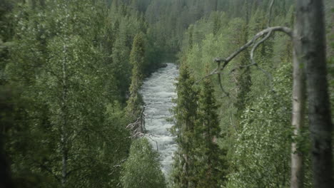 Beautiful-Wide-shot-of-a-People-River-Rafting-in-the-Finish-Forest,-Karhunkierros,-Oulanka,-Rukka,-Aallokkokoski