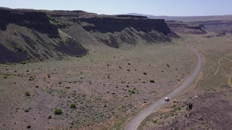 Aerial-tracking-vehicle-rotates-to-reveal-scablands-canyons,-coulees
