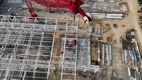 4K-Aerial-close-up-of-BlueOval-City-crane-in-Stanton,-TN