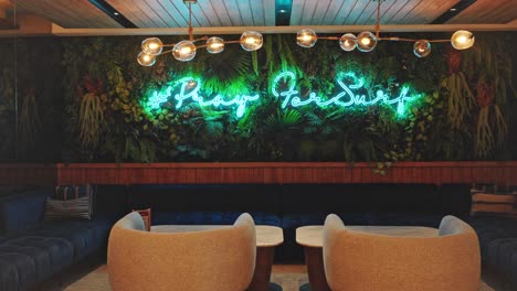 Hotel-lobby-lounge-room-with-glowing-neon-sign