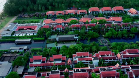 Aerial-view-of-Luxury-hotel-of-Marriott-on-the-beach,-blue-clear-water-and-lush-tropical-greenery