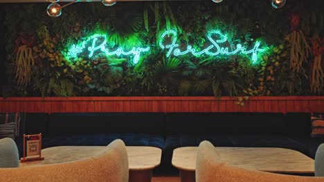 Praying-for-surf-neon-sign-in-hotel-lobby