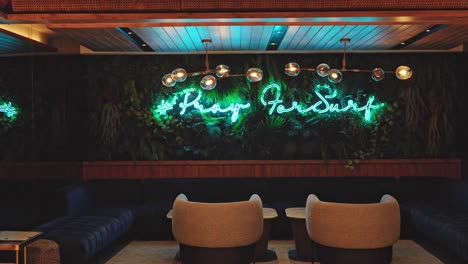 Unique-sitting-lounge-area-of-hotel-with-neon-sign