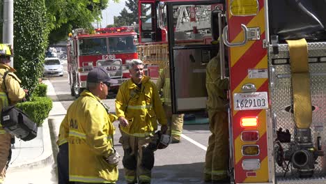 firefighters-gather-equipment-from-truck