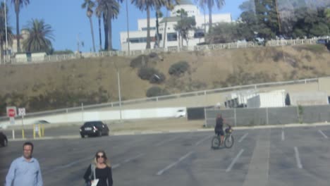 man-rides-bike-around-parking-garage