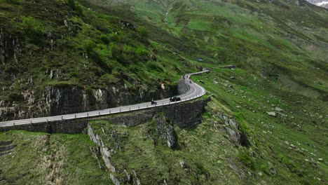 Aerial-View-Of-Furka-Pass-High-Mountain-Road-Winding-Through-The-Swiss-Alps