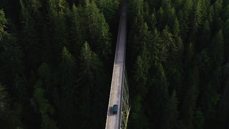 Drone-shot-following-a-car-driving-on-the-High-Steel-Bridge,-in-Washington,-USA