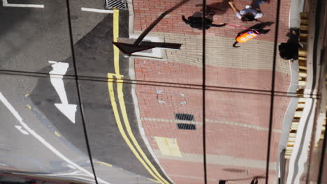 pedestrian-mirror-reflection-while-walking-in-city-center