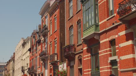 Red-Brick-Walls-Facade-With-Balcony-On-The-Street-Of-Brussels,-Belgium