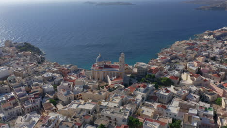 Aerial:-Slow-panning-drone-shot-of-Saint-Nicholas-church-in-Ermoupoli-of-Syros-island,-Greece