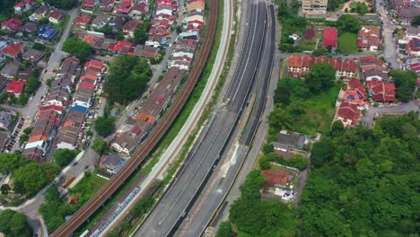Aerial-birds-eye-view,-drone-flyover-Taman-Desa-Seputeh-capturing-highways-and-residential-neighborhood-at-Kuala-Lumpur,-Malaysia