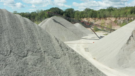 Daylight-Aerial-Panning-of-Limestone-Piles-and-Conveyor-Belt-at-Quarry