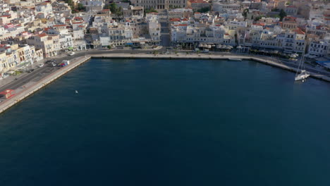 Aerial:-Reveal-shot-of-Ermoupoli-in-Syros,-Greece-during-sunrise