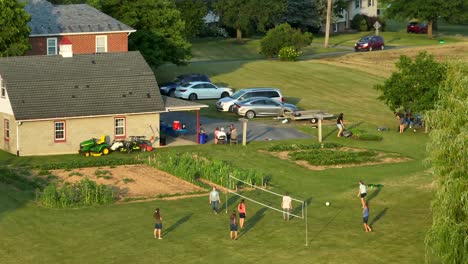 Family-gathering-with-volleyball-at-farmhouse