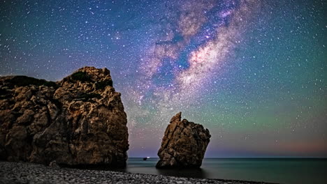 The-captivating-splendor-of-the-night-sky-above,-resembling-an-entirely-different-realm,-is-beautifully-captured-in-the-mesmerizing-timelapse-footage-recorded-at-the-beach-in-Paphos,-Cyprus