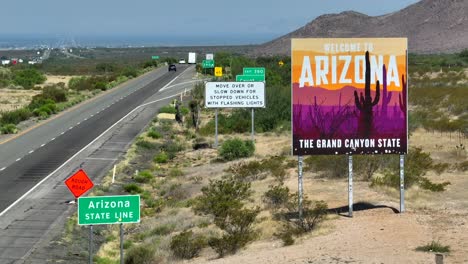 Arizona-state-line-and-welcome-sign-along-interstate-highway-entering-the-Grand-Canyon-State