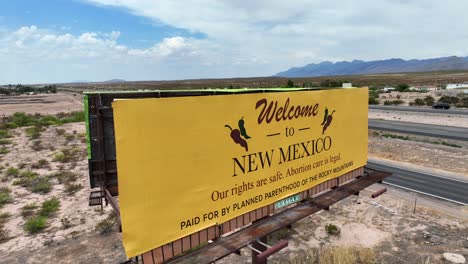 Welcome-to-New-Mexico-yellow-road-sign-funded-by-Planned-Parenthood