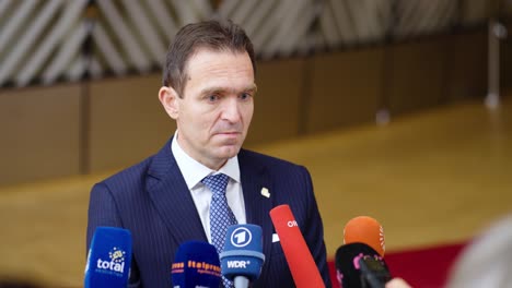 Prime-Minister-of-Slovakia-Ľudovit-Odor-giving-an-interview-at-the-European-Council-summit-in-Brussels,-Belgium---Slow-motion-shot