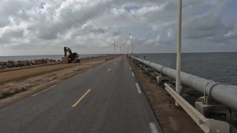 Roman-bridge-connecting-Djerba-island-to-mainland-in-Tunisia-shot-from-driving-car