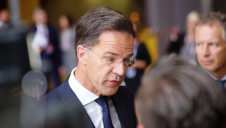 Prime-Minister-of-the-Netherlands-Mark-Rutte-giving-an-interview-during-the-European-Council-summit-in-Brussels,-Belgium---Slow-motion-shot