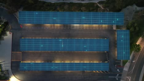 Aerial-view-above-solar-panels-powering-lights-and-cars-at-a-Carport-EV-station
