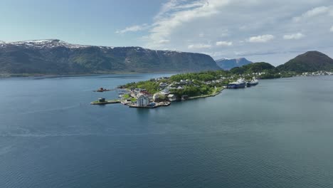 Aspoy-and-Slinningen-island-in-Alesund-Norway---Approaching-aerial-above-sea-during-summer