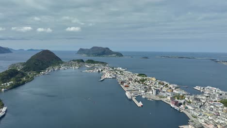Stunning-city-of-Alesund-Norway---High-altitude-panoramic-view-showing-full-city-view-and-coastal-islands-with-Atlantic-Ocean-background