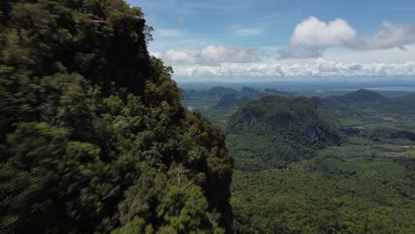 Drone-reveal-shot-of-Krabi-Thailand-and-its-rocky-hills-and-green-jungles