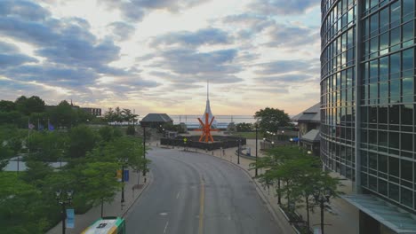 Drone-view-from-downtown-Milwaukee-of-dawn-on-Lake-Michigan-flying-forward-on-E-Wisconsin-Avenue-toward-the-Art-Museum-designed-by-Santiago-Calatrava