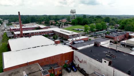 Asheboro-NC,-North-Carolina-aerial-push-in-over-hosiery,-textile-mill
