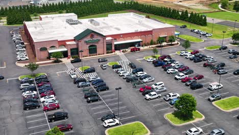 The-video-begins-with-a-wide-shot-capturing-the-entire-Harris-Teeter-store-and-its-surroundings